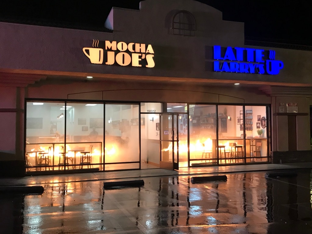 Mocha Joe's and Latte Larry's storefront set at night